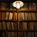 Light Bulb Beside Books on Shelf